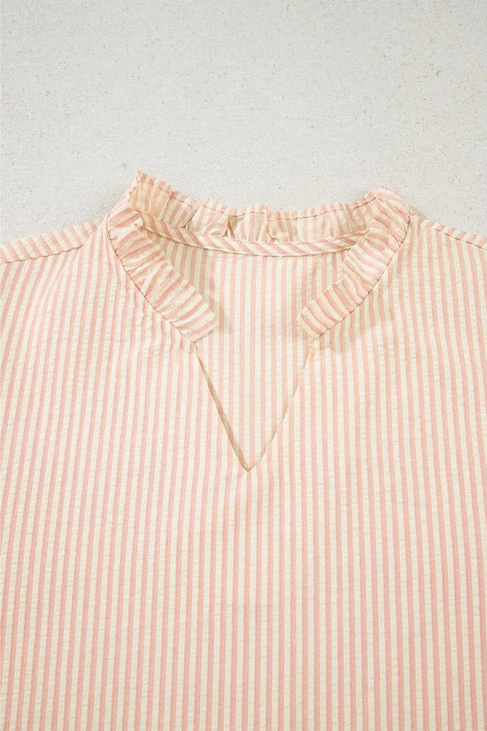 Close-up of the ruffled V-neckline on the Bow Cuff Pearl Embellished Blouse, showcasing elegant striped fabric detail.