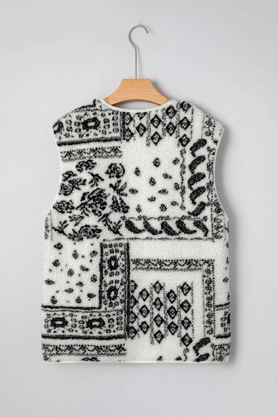 Back view of the beige sherpa vest with black paisley pattern, ideal for autumn outerwear and Western-style fashion.