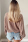 Person wearing a Game Day Graphic Crop Top and denim shorts with a neutral background