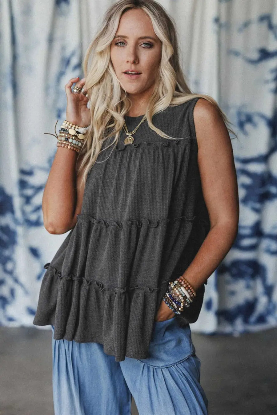 Front view of dark grey tiered frill tank top for women styled casually, ideal for summer wear with breezy comfort.