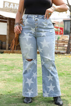 Blue star printed plus size jeans with distressed details and wide-leg silhouette, styled with black boots for a casual summer look.