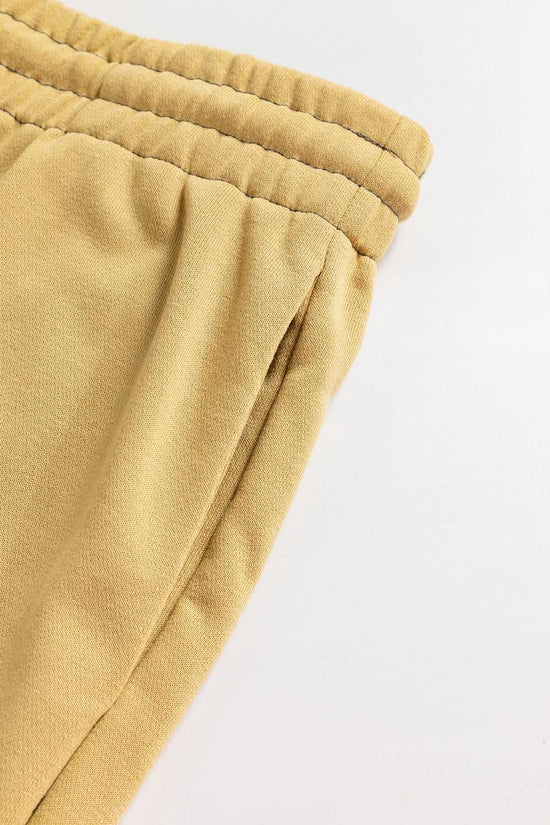 Detail view of side pocket and waistband on beige Terry Knit Drawstring Sweatpants, designed for plus size casual daily wear.