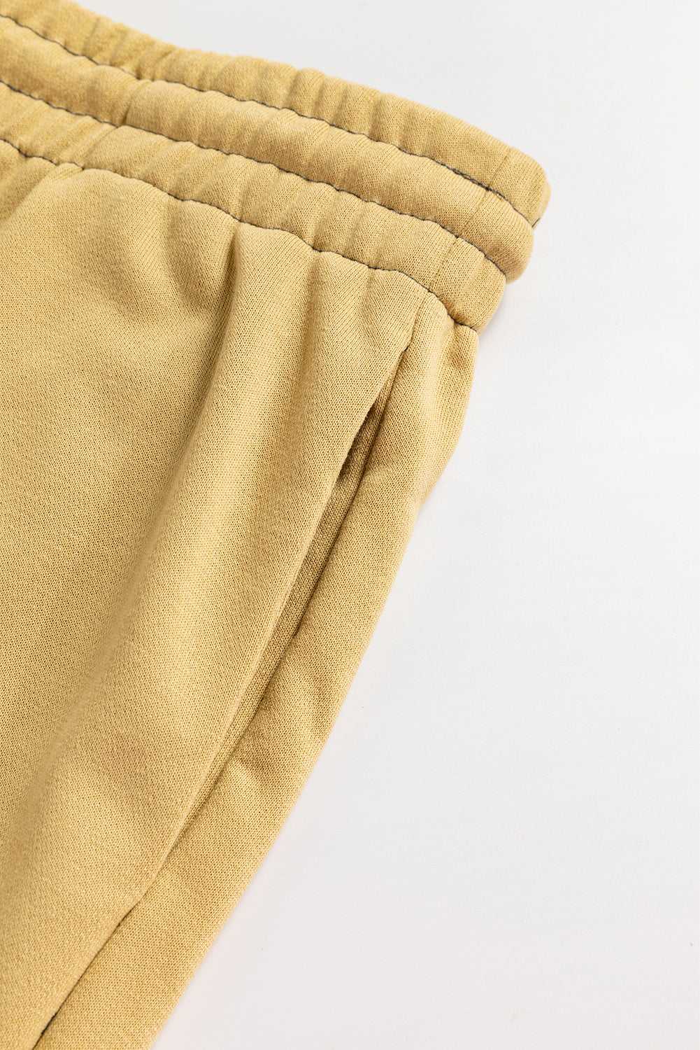 Detail view of side pocket and waistband on beige Terry Knit Drawstring Sweatpants, designed for plus size casual daily wear.