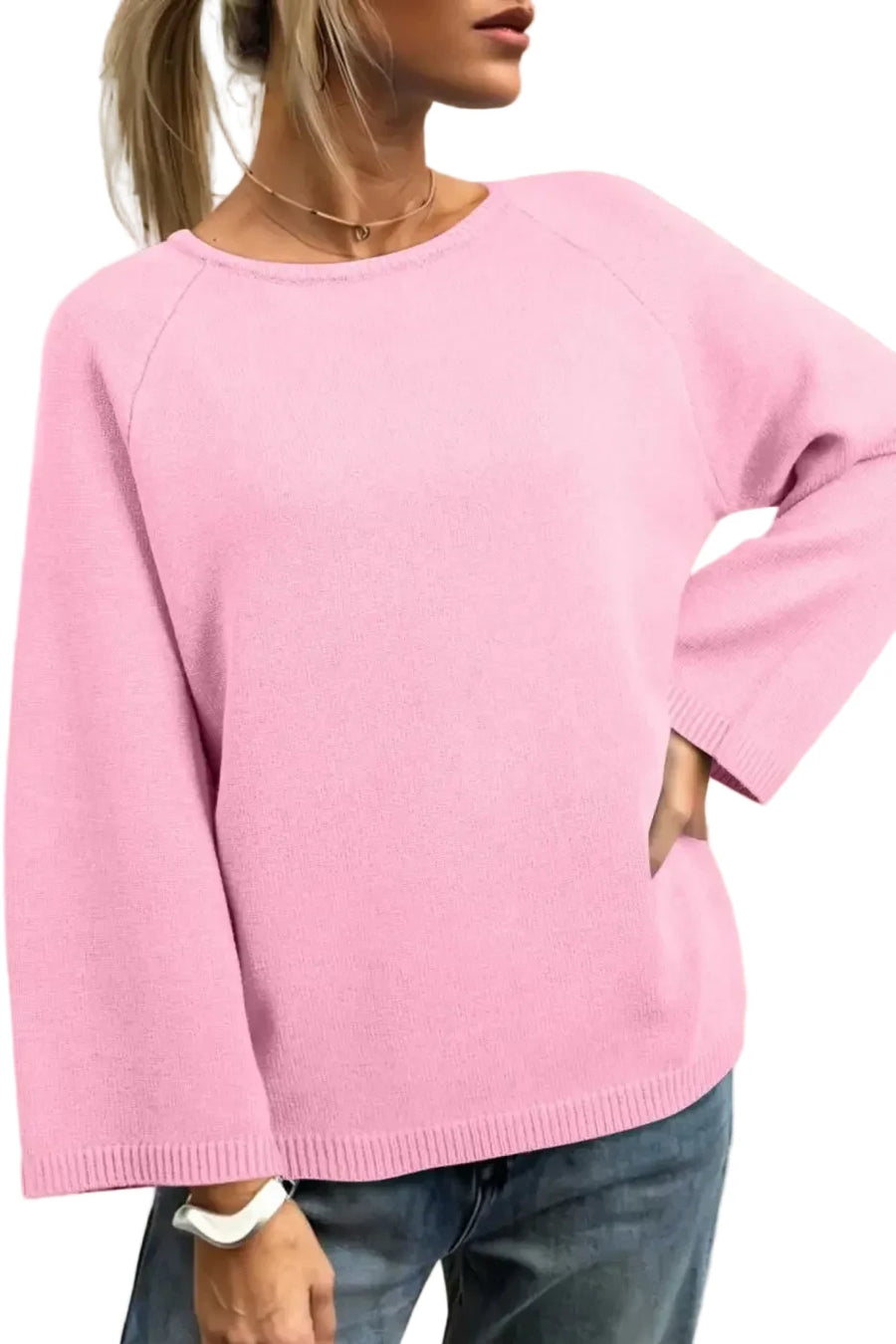 Bell Sleeve Loose Knit Jumper in pink with relaxed fit and wide sleeves, styled casually with jeans for fall layering.