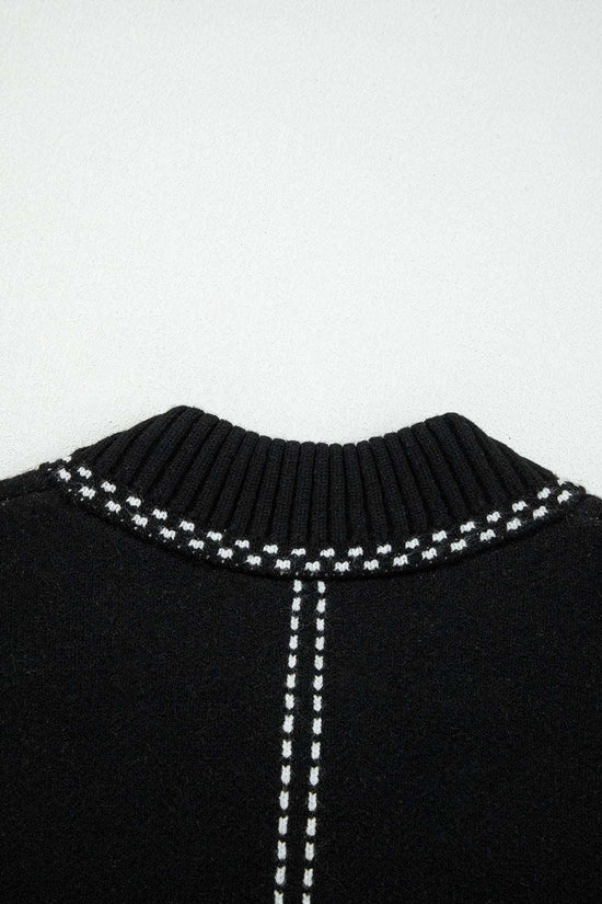 Detailed view of back neckline on Women's Black Contrast Trim Knitted Cardigan highlighting ribbed collar and contrast stitching.