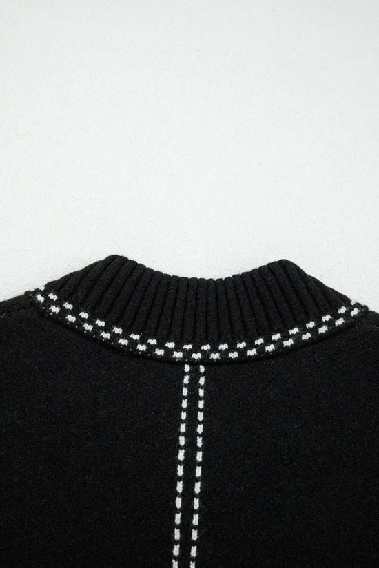 Detailed view of back neckline on Women's Black Contrast Trim Knitted Cardigan highlighting ribbed collar and contrast stitching.