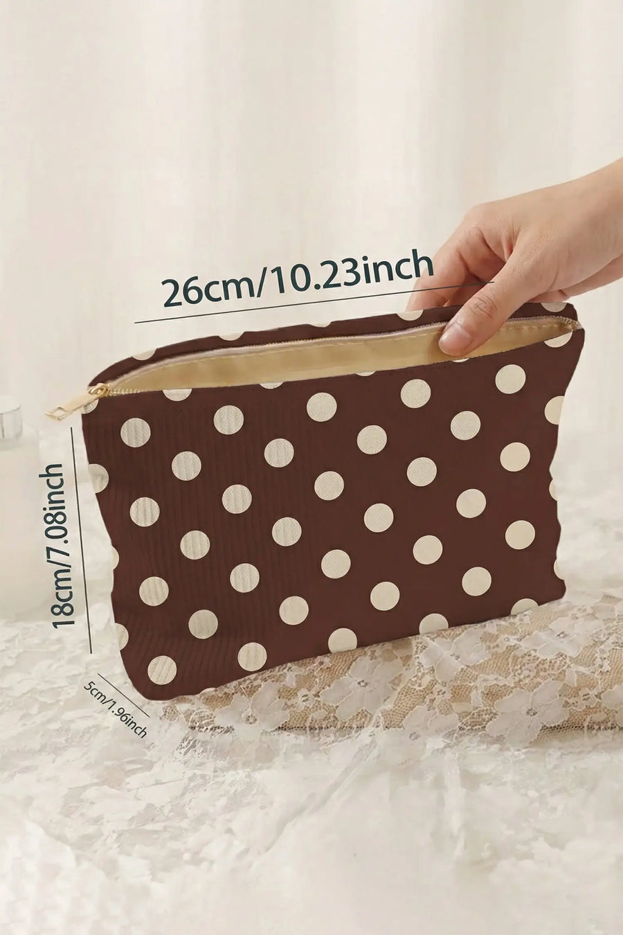 Women's polka dot makeup bag detail view corduroy texture