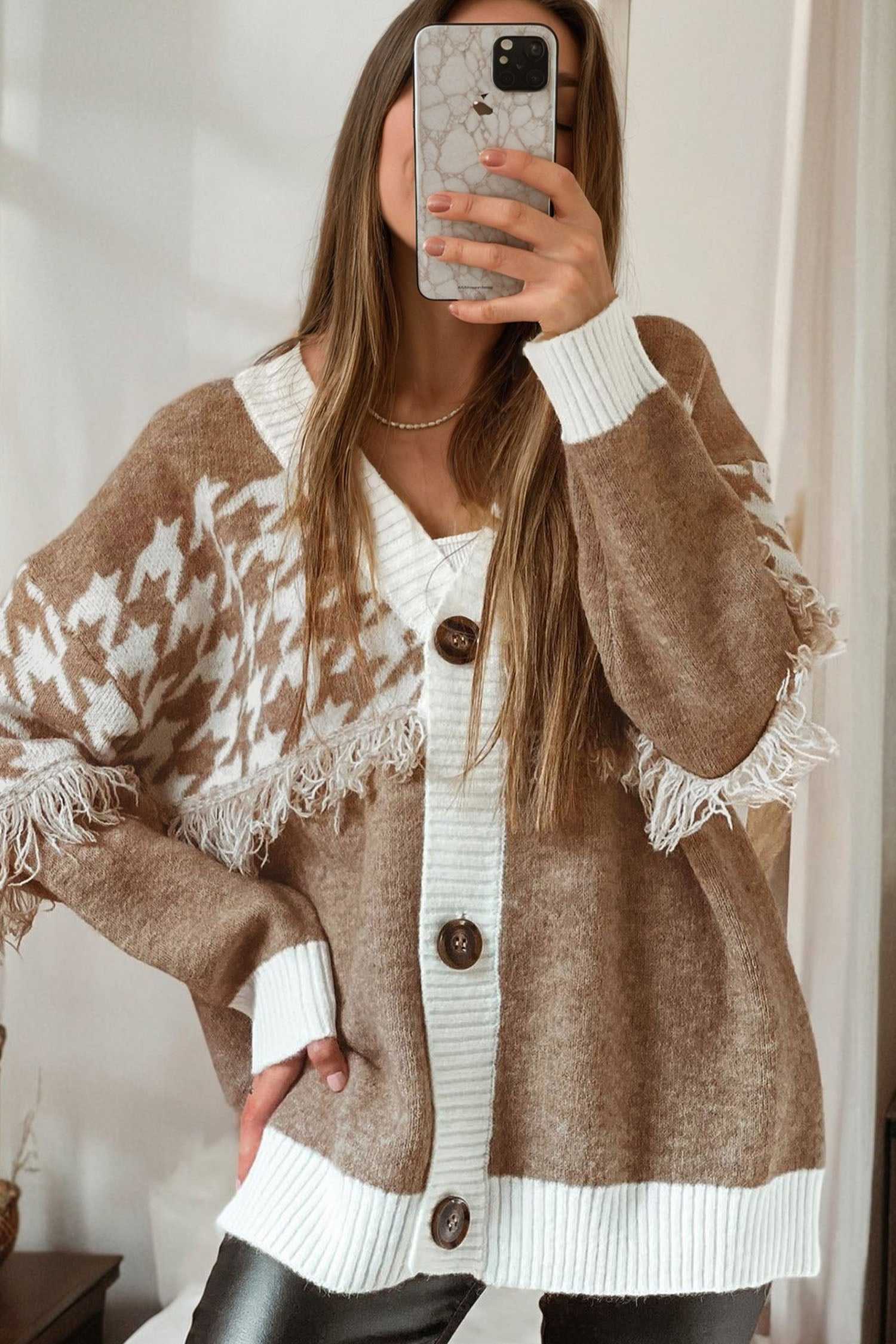 Women’s khaki houndstooth knit cardigan featuring button front, long sleeves, and textured fringe for a cozy smart-casual autumn look.