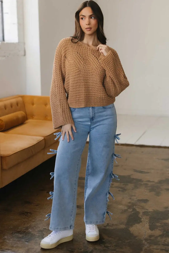 Lightweight Wide Sleeve Hollow Knit Jumper paired with high-waisted jeans, ideal for smart-casual autumn outfits in women's knitwear.