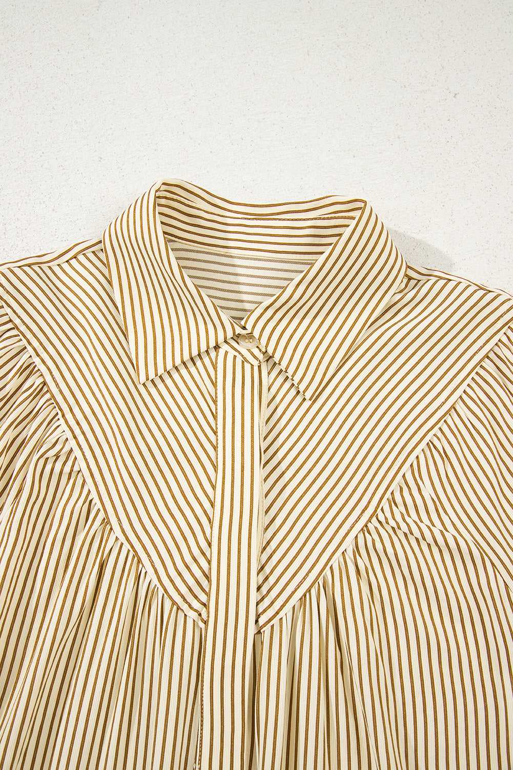 Close-up of Brown Stripe Mini Dress collar and yoke detail. Features crisp vertical and diagonal stripe pattern for added texture.