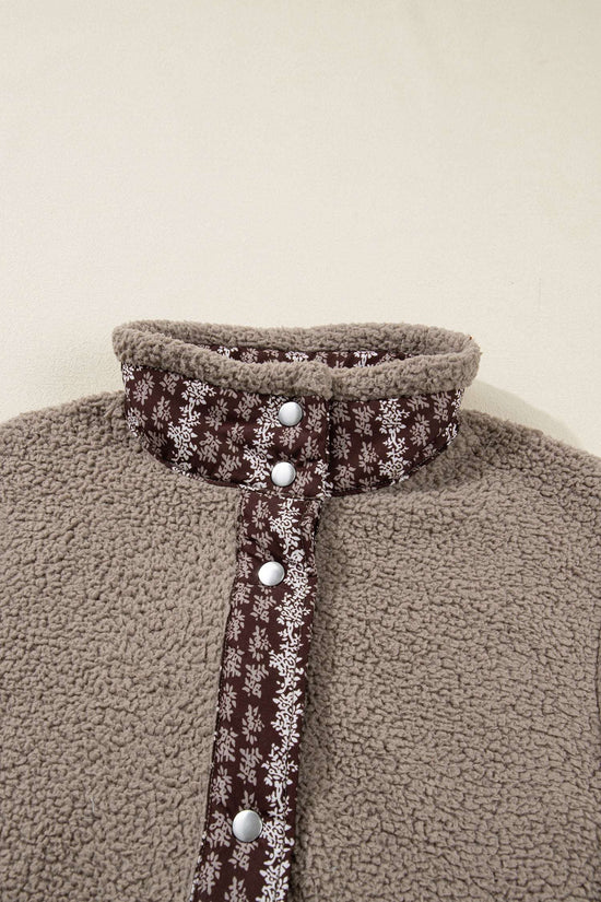 Close-up of collar and button placket on Women's Country Borg Fleece Gilet Winter Vest FashionFitz with brown floral trim and snap buttons.