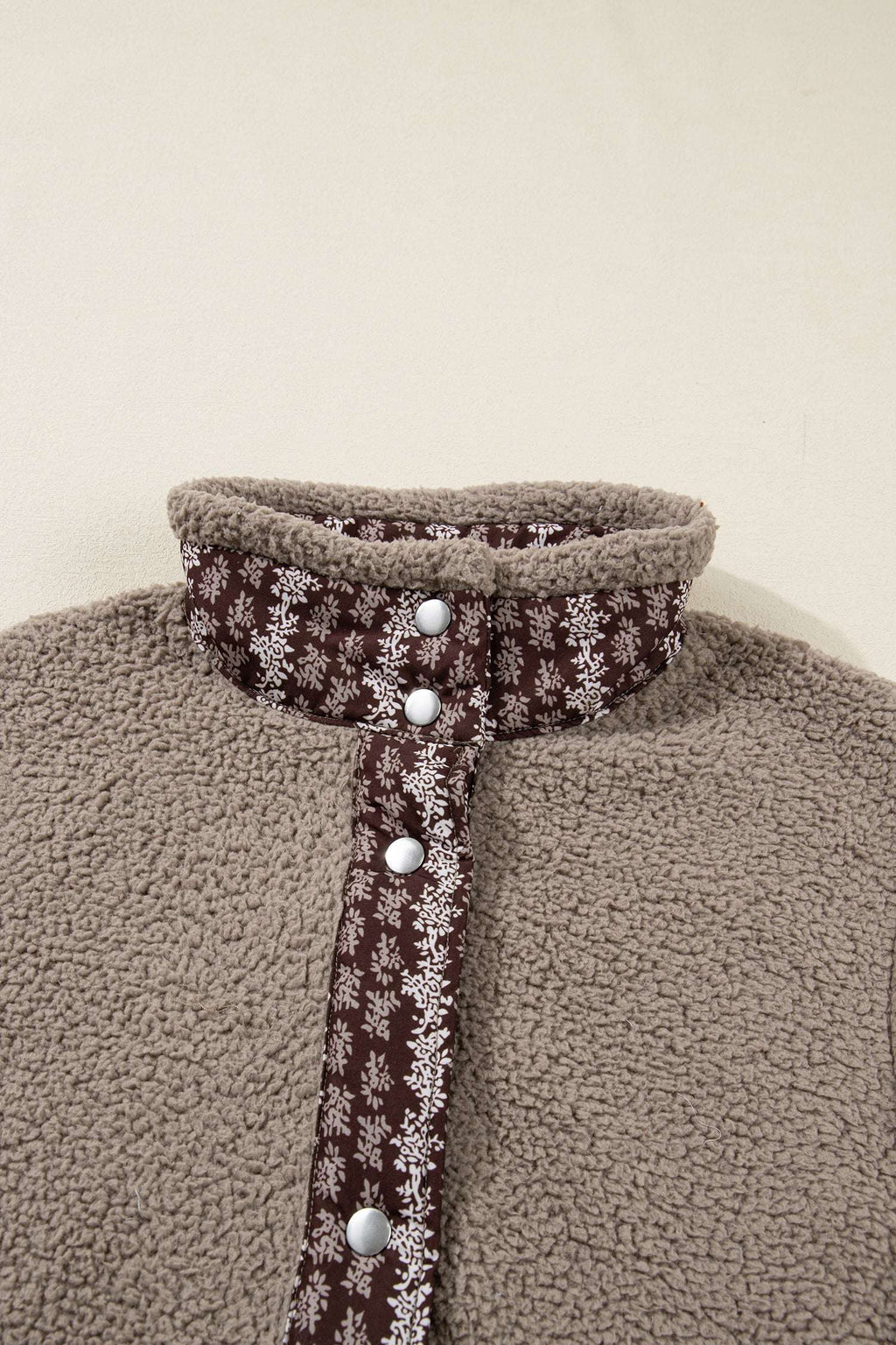 Close-up of collar and button placket on Women's Country Borg Fleece Gilet Winter Vest FashionFitz with brown floral trim and snap buttons.
