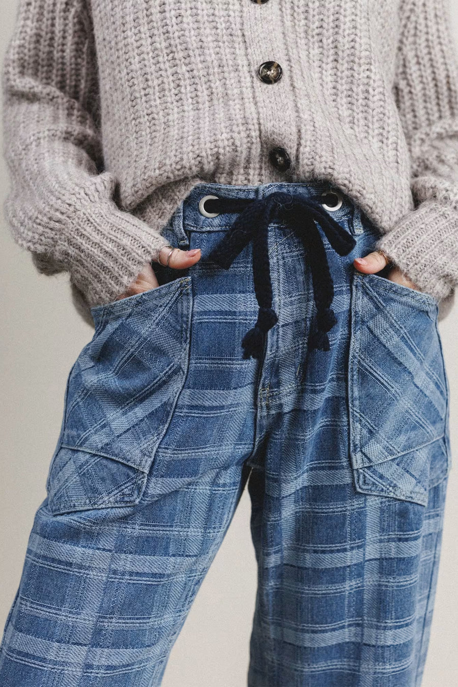 Plaid denim drawstring jeans styled with white tee and trainers — Fashionfitz UK