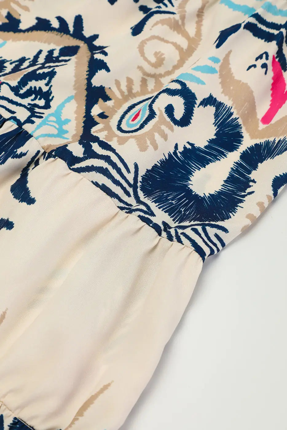 Gathered seam detail on the Tribal Mini Dress, highlighting the tiered A-line silhouette and boho pattern.