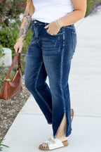 Close-up side angle of Dirty Blue Side‑Slit Flare Jeans – Curve showing distressed detailing and slit hem for a trendy casual look.