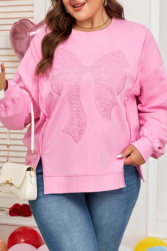 Close-up of lace bow detail on Plus Size Pink Sweatshirt. Features ribbed cuffs and hem with a soft, stretchy fabric.