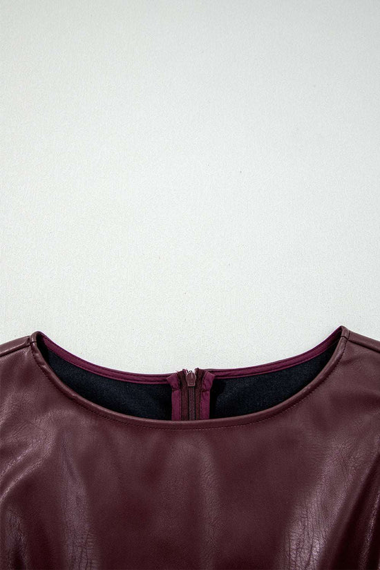 Detailed neckline view of Brown Faux Leather Sleeveless Mini Dress showing inner lining and zipper finish.