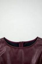 Detailed neckline view of Brown Faux Leather Sleeveless Mini Dress showing inner lining and zipper finish.