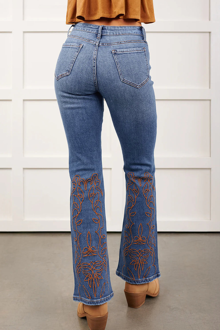 Embroidered flare leg jeans — side view showing high waist and flare from knee