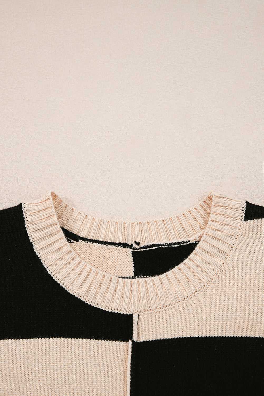 Close-up of neckline on Monochrome Knit Dress - Cozy & Stylish | FashionFitz with ribbed collar and stitched center seam detail.