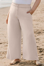 Side angle of Wide Leg Plus Linen Pants with pockets and flowy silhouette. Comfortable viscose-linen blend trousers for spring and summer.