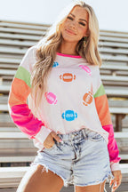 Pink GAME DAY Graphic Top with colorful football prints and color block sleeves, styled with denim shorts for a casual fall look.