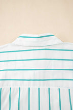 Close-up of a white shirt with green stripes on a beige background