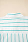Close-up of a white shirt with green stripes on a beige background