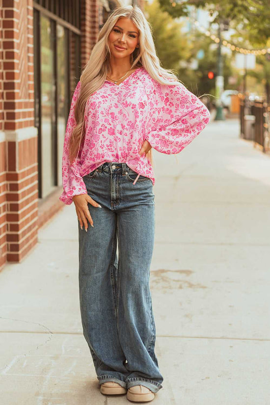 Model in Pink Floral Lightweight Blouse with relaxed fit and vibrant floral print, styled for everyday elegance.