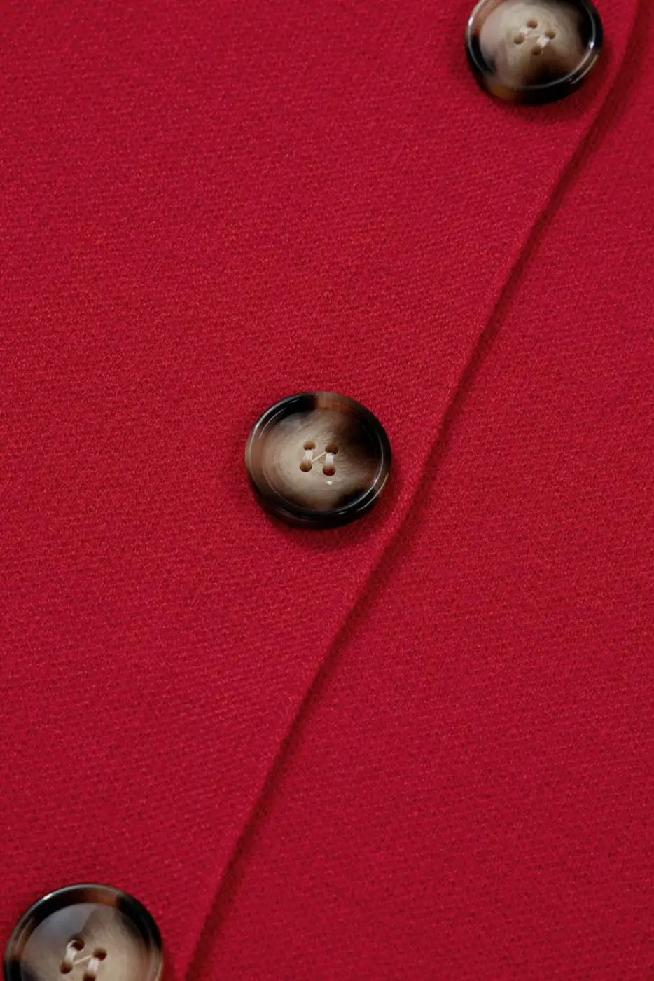 Detailed close-up of tortoiseshell buttons on the Women's Red Collared Wrap Cardigan Jacket, emphasizing stylish accents.