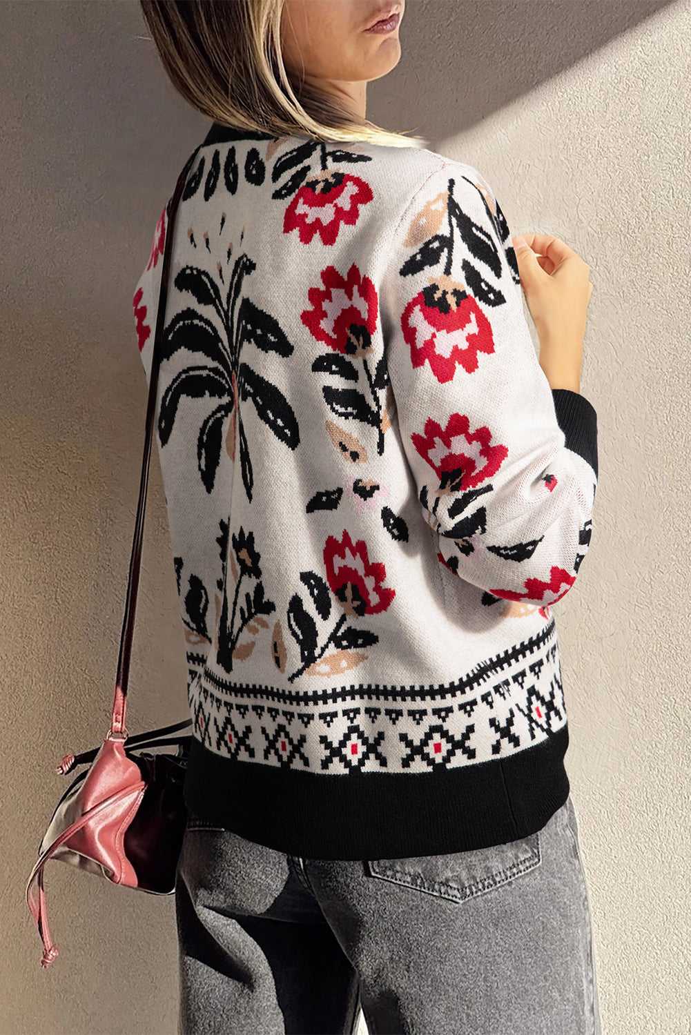 Feminine beige floral cardigan styled with jeans for autumn layering