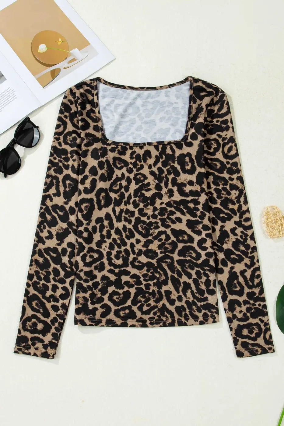 Flat lay of leopard print slim long sleeve top with square neckline, ideal for casual wear or layering in spring fashion.