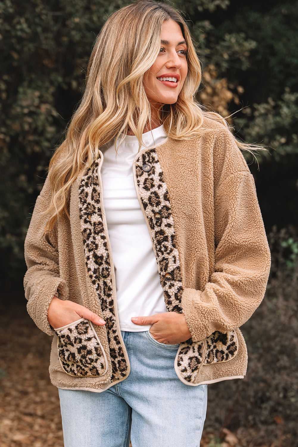 Women’s plush leopard print jacket with fleece texture, featuring front leopard panels and patch pockets. Ideal for autumn layering.