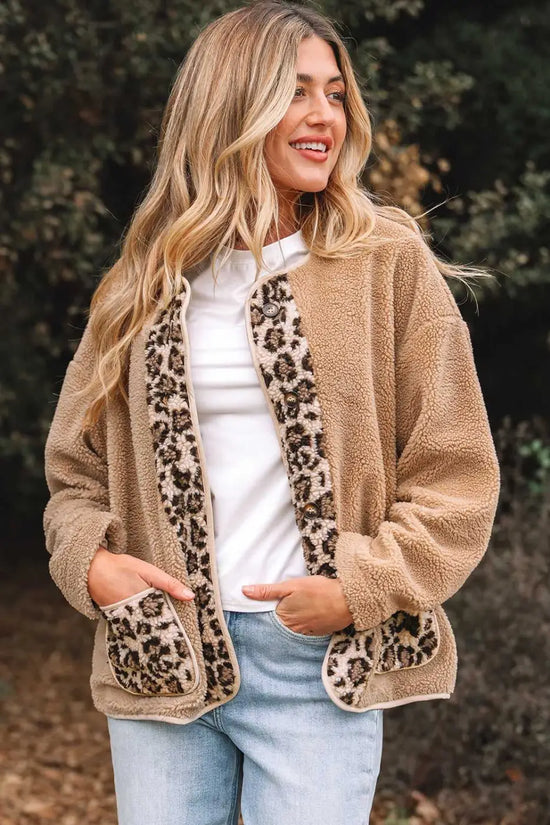 Women’s plush leopard print jacket with fleece texture, featuring front leopard panels and patch pockets. Ideal for autumn layering.