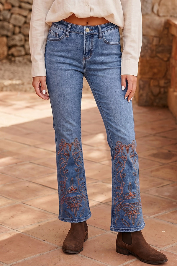 Embroidered flare leg jeans in mid-wash blue — front view showing full flare leg silhouette