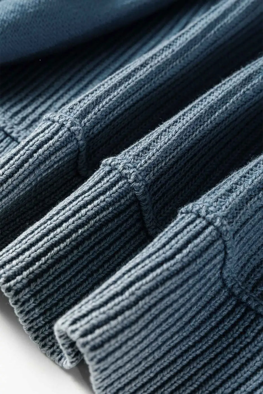Blue ribbed sleeve detail on Women's Stonewash Patchwork Knit Open Cardigan, highlighting structured knit and patchwork seams.