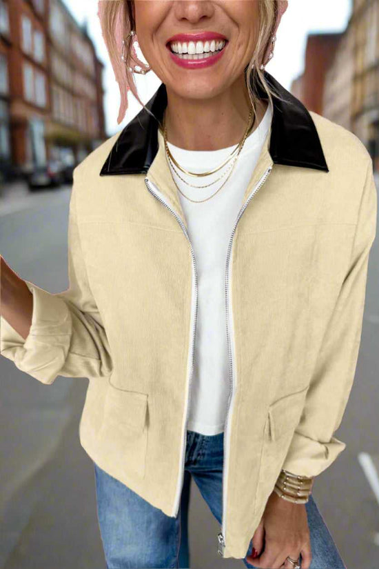Leather Collar Corduroy Jacket in beige with black leather collar, styled casually with jeans for a modern fall layering look.