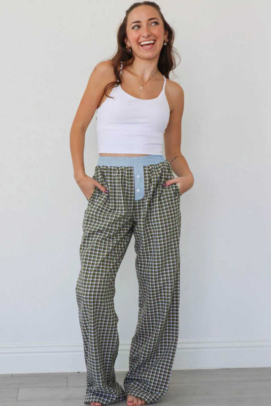 Model wearing Ladies Brown Gingham Boxer Trousers by FashionFitz styled with a white crop top, showcasing the oversized fit and comfy lounge design.