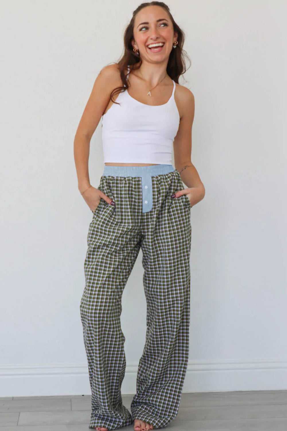 Model wearing Ladies Brown Gingham Boxer Trousers by FashionFitz styled with a white crop top, showcasing the oversized fit and comfy lounge design.