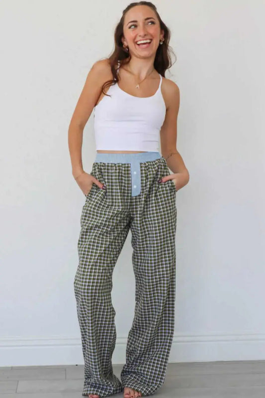 Model wearing Ladies Brown Gingham Boxer Trousers by FashionFitz styled with a white crop top, showcasing the oversized fit and comfy lounge design.