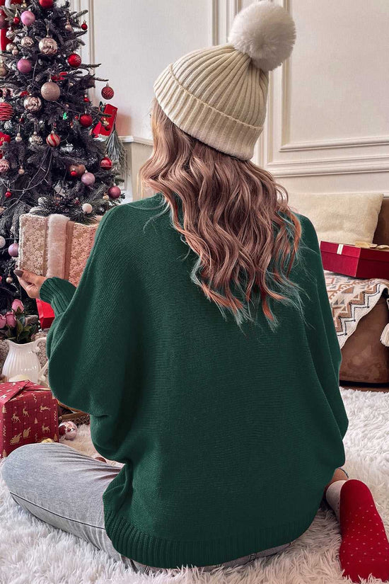 Back view of green Stylish High Neck Red Sweater - Christmas, styled with a beanie and surrounded by holiday gifts under a Christmas tree.