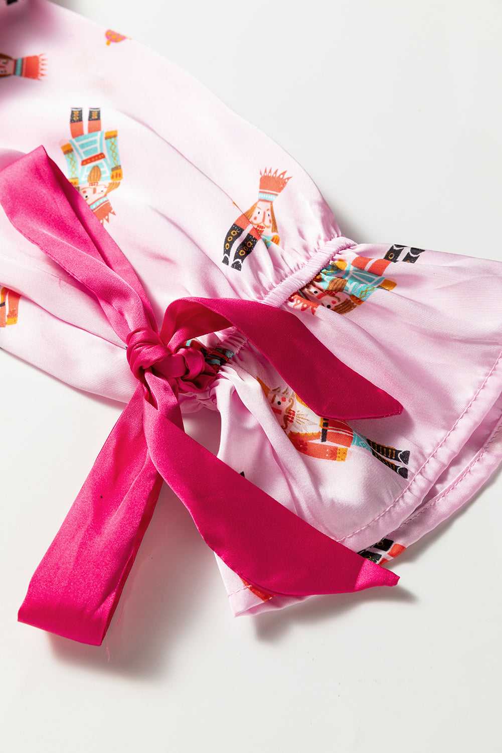 Bow and trim detail on festive satin pyjama top