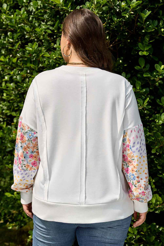 Back view of plus size floral sleeve sweatshirt showing seam detail and vibrant multicolor patchwork sleeves. Ideal for autumn daily wear.