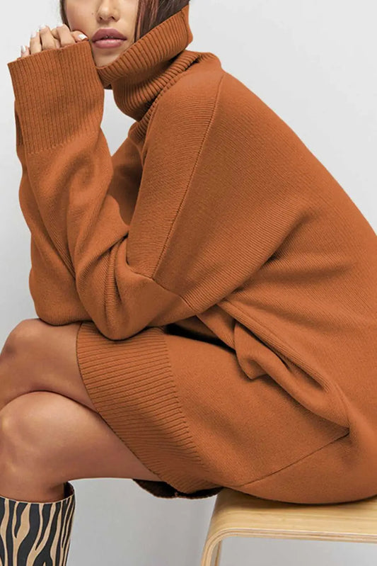 Person wearing a brown Oversized Turtleneck Jumper Dress sitting on a chair.