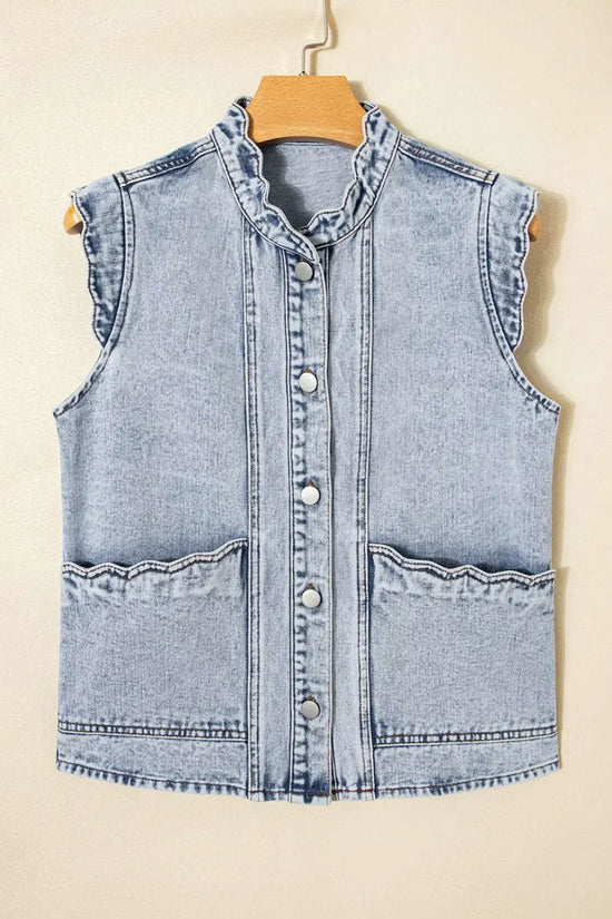 Flat lay of Beau Blue Scallop‑Trim Denim Waistcoat on hanger, featuring scallop trim collar and front flap pockets in soft denim.