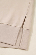 Detail of hem and side slit on beige Oversized Sweatshirt, part of the Matching Set designed for comfort and modern casual style.