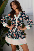 Ladies blue floral shift mini dress with striped trim, featuring a relaxed H-line silhouette and bohemian floral print, ideal for spring wear.