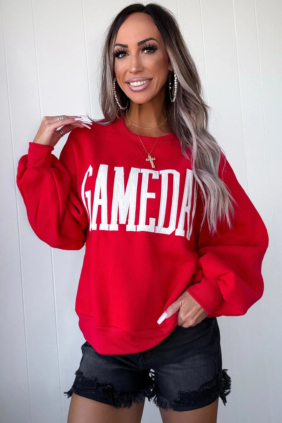 GAMEDAY embroidered patch sweatshirt — model lifestyle detail shot