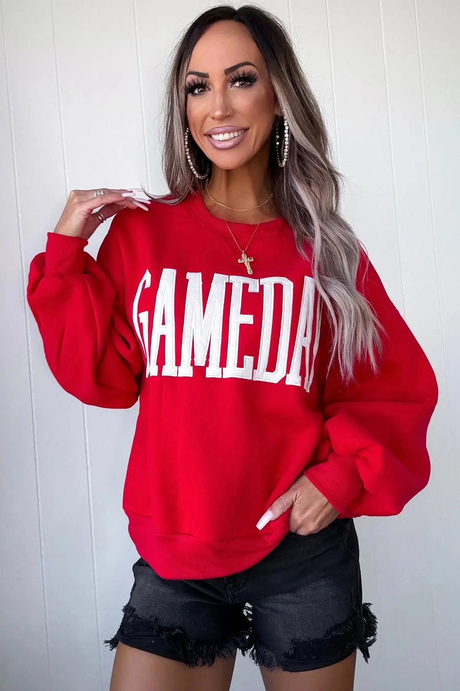 GAMEDAY embroidered patch sweatshirt — model lifestyle detail shot