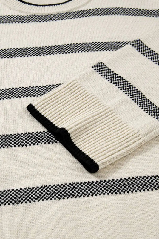 Detailed view of bell sleeve on Women's Apricot Striped Bell Sleeve Jumper, showing ribbed cuff and stripe pattern. Cozy and fashionable knitwear.